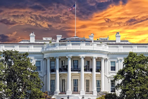 image of the white house with american flag