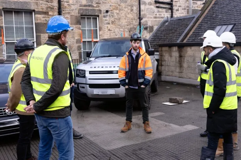 Charlie and Construction Workers on Site