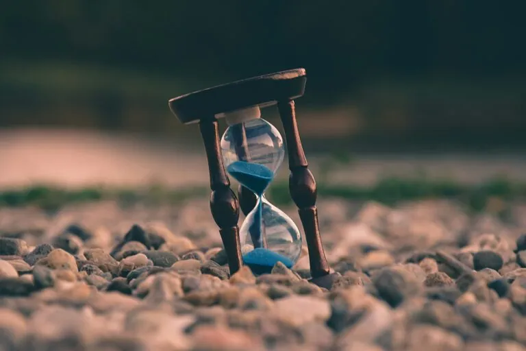 Hour glass in sand